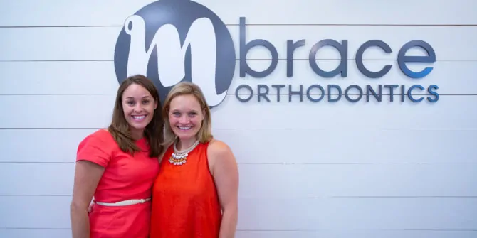 Mbrace Orthodontics Doctor Portraits 1 2 670x335 - Meet Our Orthodontists Dr. Meghann Dombroski & Dr. Tarryn MacCarthy